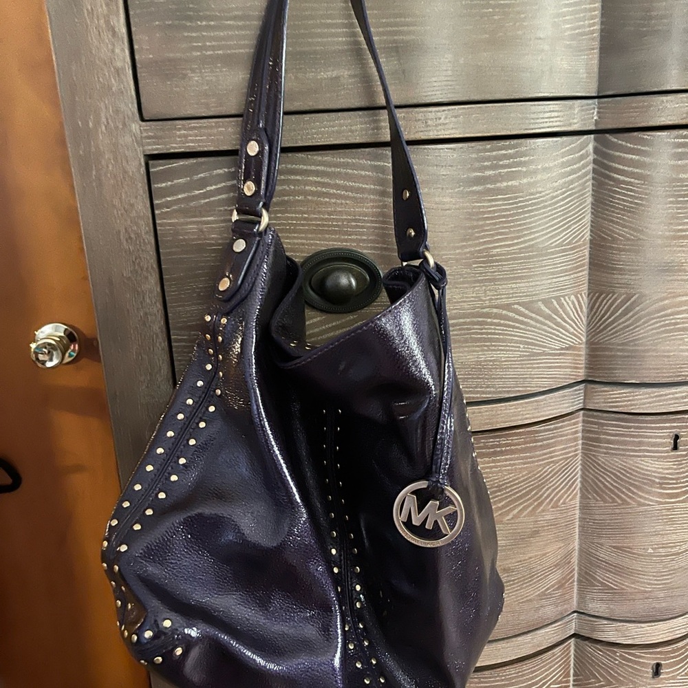 Michael Kors purple crinkle patent hobo bag.